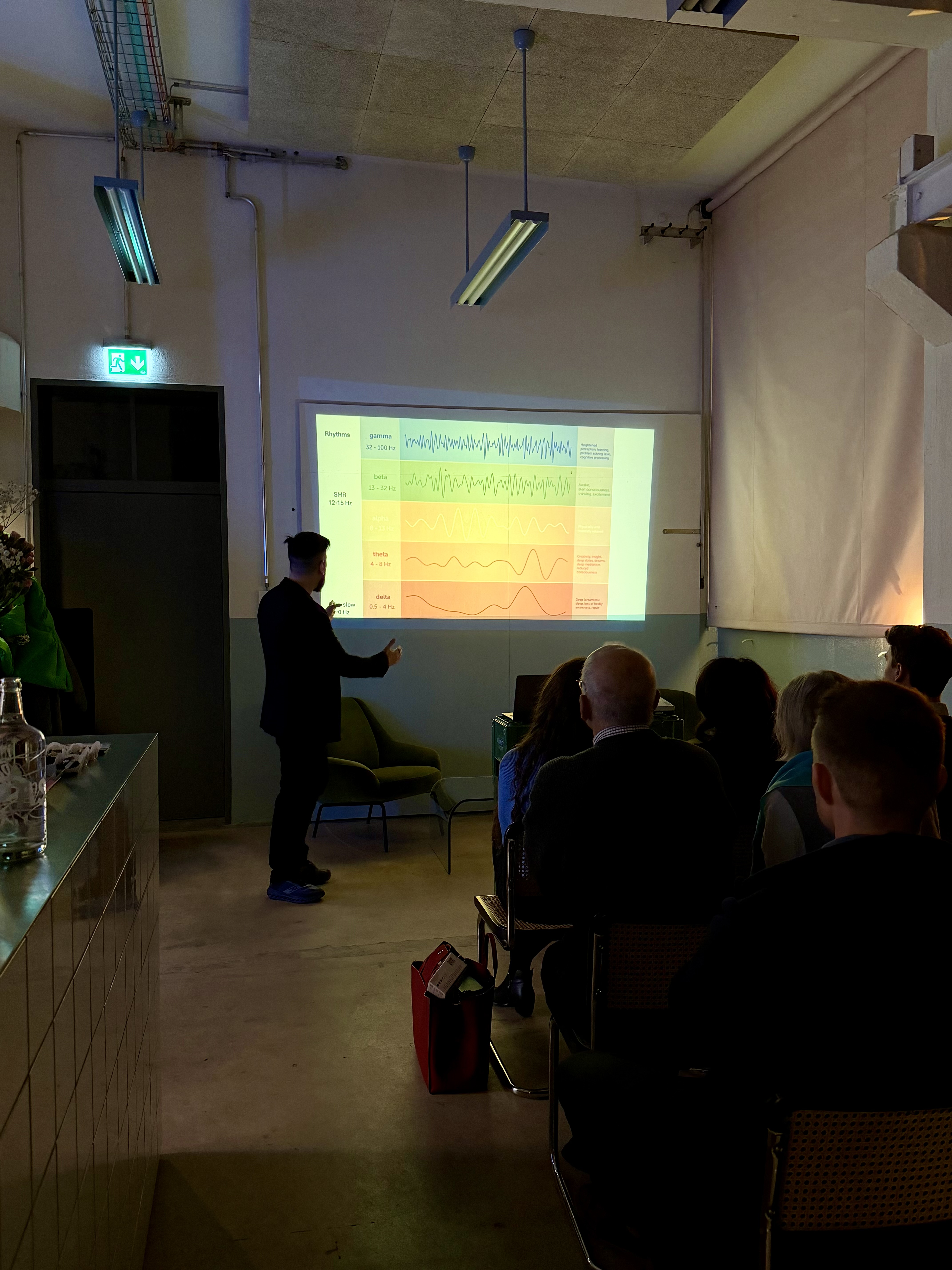 Dr. Dimitris Messinis presenting on neurofeedback technology at Nourish Your Mind